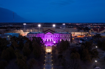 Christy at night bathed in purple light